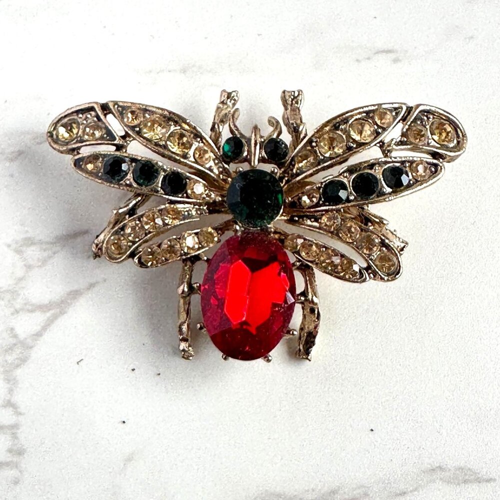 Vintage Gold Tone Moth Brooch With Red & Green Glass Rhinestones